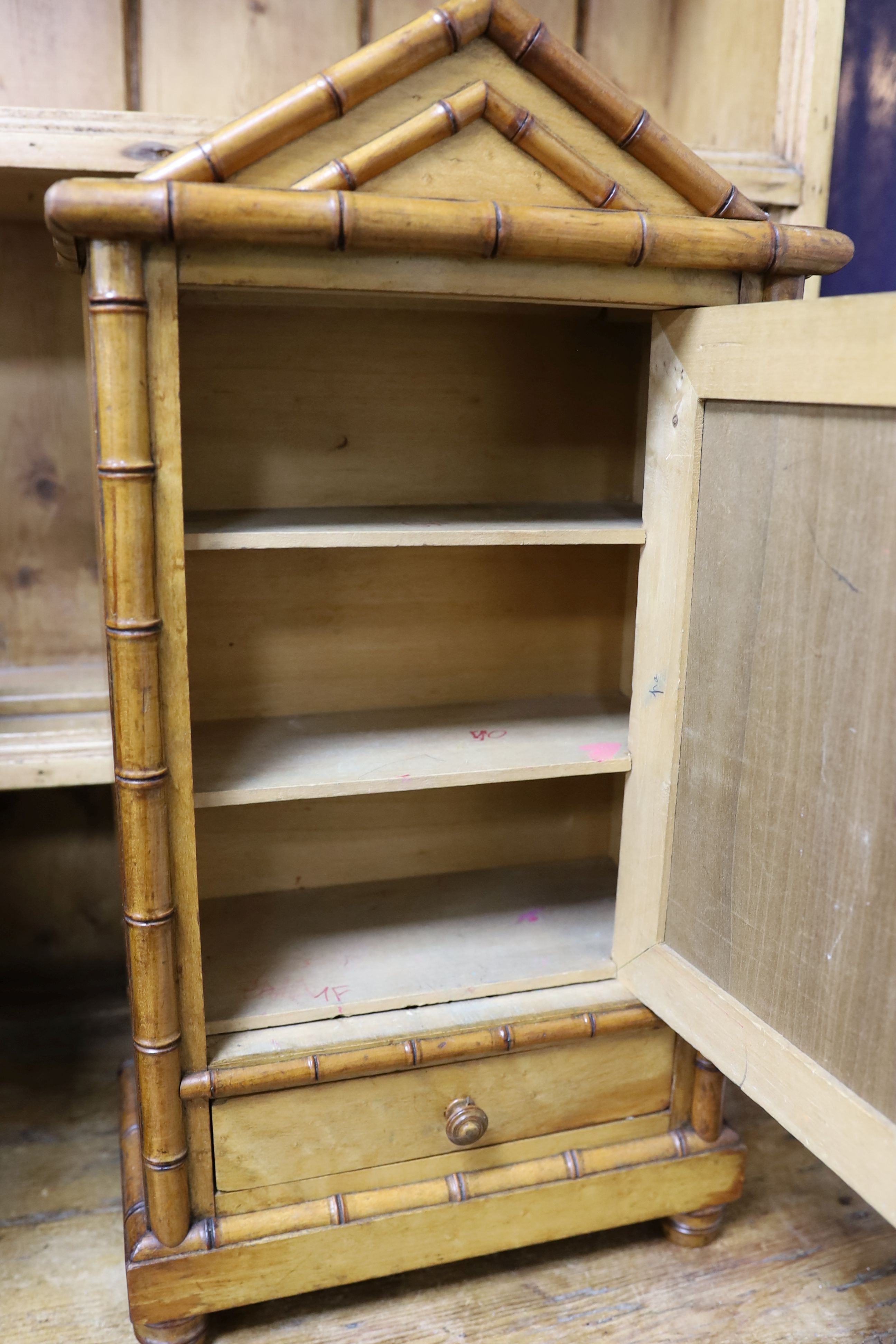 A 19th century French miniature birds eye maple and pine armoire, width 27cm, depth 14cm, height 50cm